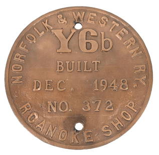 N&W RR Y6B BUILDER’S PLATE: A cast bronze builder’s plate from N&W Y6b, road number 2180. The plate shows a long-ago cleaned front surface with a heavily patinaed back surface. There are some washer impressions on both of