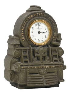 NORFOLK & WESTERN CENTENNIAL PROMOTIONAL CLOCK: A beautiful cast iron promotional of a modern articulated N&W steam locomotive front. There is a pocket-watch-sized New Haven clock in the area of the smoke box door, surrounded by &#8220;1837. Norfol