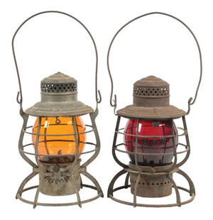 LOT OF 2 RAILROAD LANTERNS: (A) An A&W “ADAMS” steel guard model with double guard and big fount with No. 2 ratchet burner. The lid reflector is nicely embossed “N&W R.R.” in large letters. The amber No.