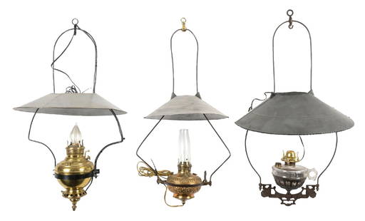 LOT OF 3 HANGING LAMPS: (A) A hanging lamp with glass fount suspended in a cast iron holder with an ornate base decoration and a hoop which holds a tin shade. The lamp has been electrified and has a low voltage power cord wi