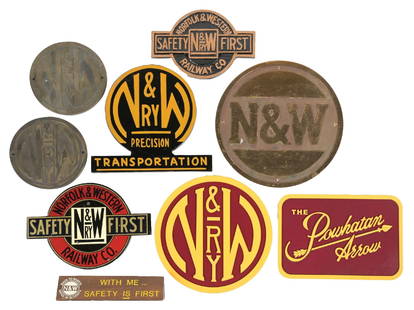 LARGE LOT OF RAILROAD SIGNS: (A) A desk pyramid sign, two-sided mahogany, “RUN THE TEAM SAFELY” with N&W logo. (B) Two cast bronze N&W circular logo signs, one with a 1938 date. (C) A cast aluminum N&W Ry Safety First