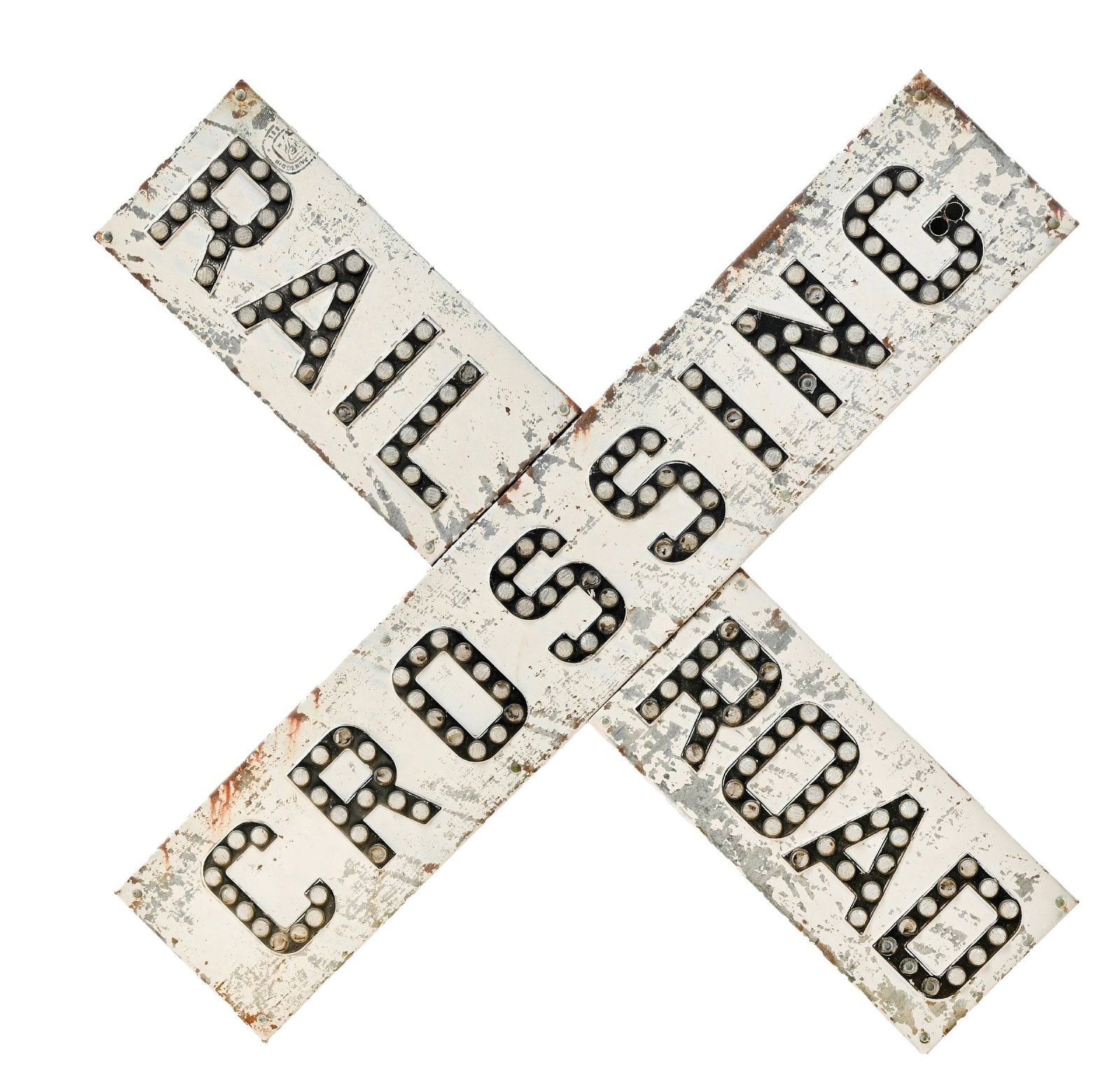 RAILROAD CROSSBUCK: A “RAILROAD CROSSING” crossbuck with reflectorized lettering. Clear reflectors outline black-painted lettering on a significantly deteriorated white background. Several of the plastic refl