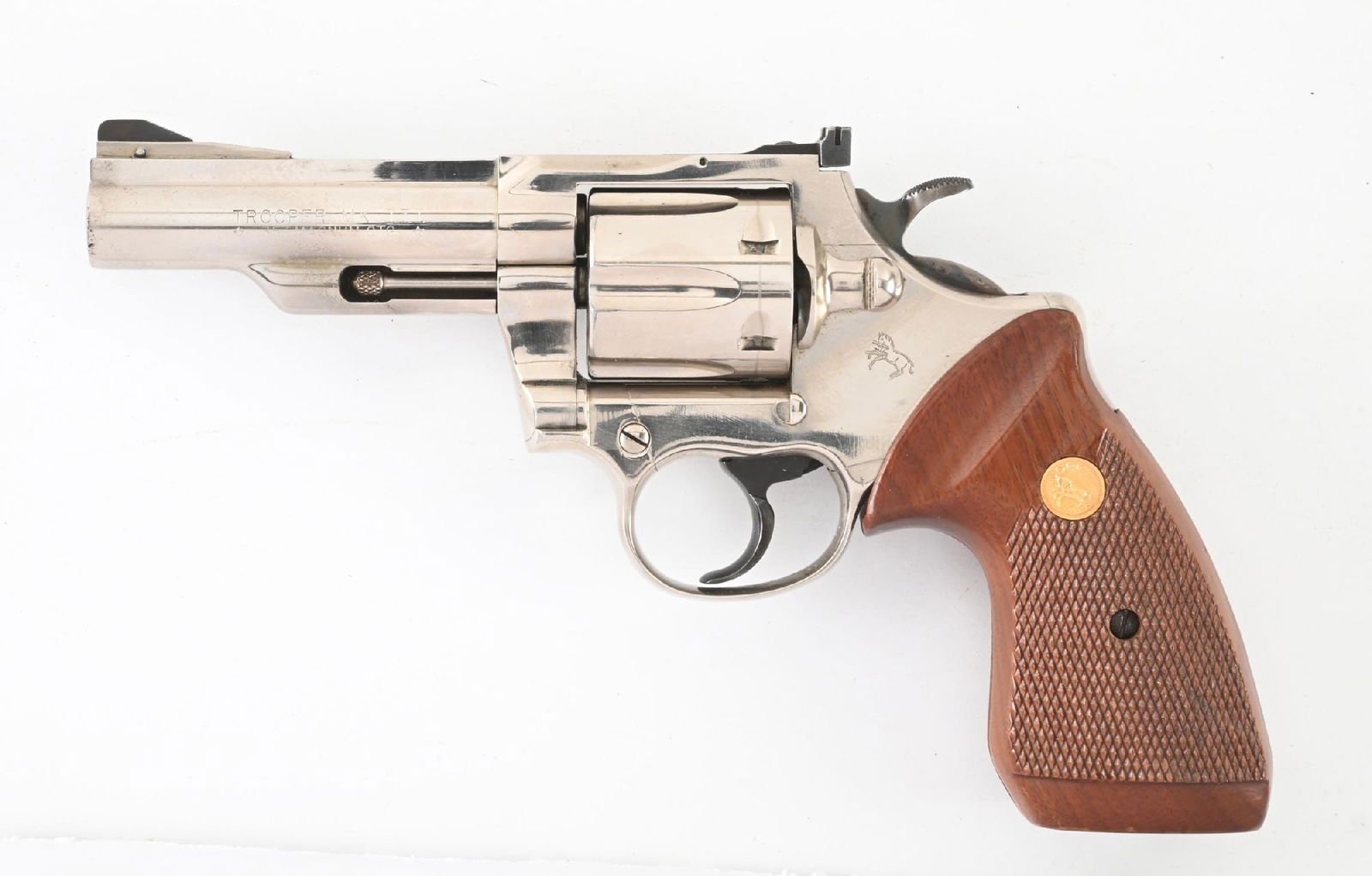 (C) COLT TROOPER MK.III .357 MAGNUM DOUBLE ACTION REVOLVER WITH BOX.: Manufactured in 1971. Nickel plated with blued wide target hammer and trigger, adjustable rear sight, ramp front sight, and checkered walnut grips with gold medallions. The early two piece box is for