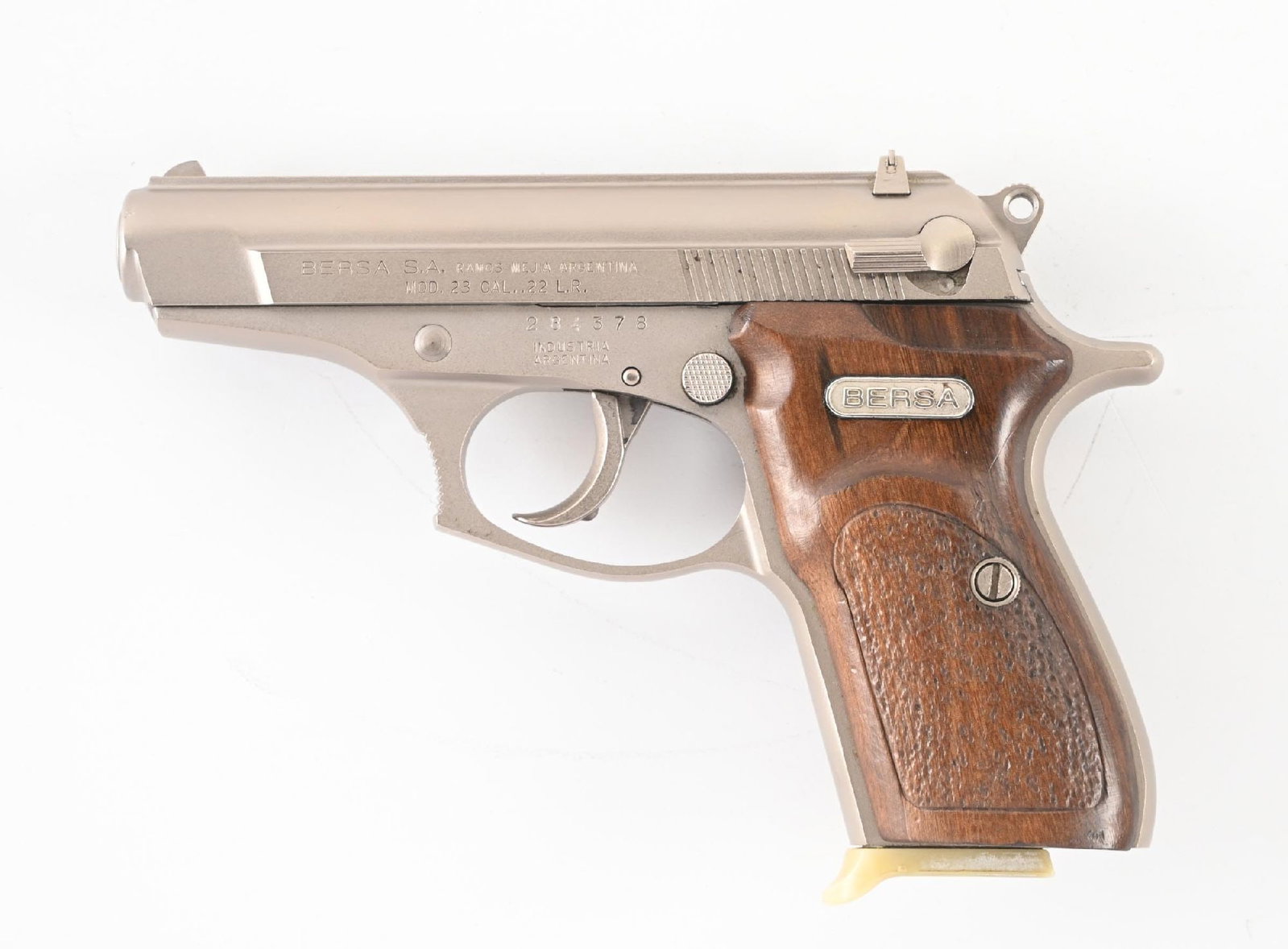 (M) BERSA MODEL 23 SEMI-AUTOMATIC DOUBLE ACTION PISTOL.: Matte slide and frame, red 3-dot sights, and stippled wood grips. CONDITION: Very Good, shiny bore, minor scuffs and abrasions from use Barrel Length: 3 - 1/2" Caliber/Bore: .22 Long Rifle Manufacture