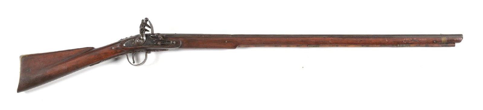 (A) NORTHWEST FLINTLOCK TRADE GUN BY BARNETT.: Two stage barrel with "EB" proof on top of breech. Convex lockplate marked "BARNETT / 1855". Large iron trigger guard, engraved brass buttplate, and serpent sideplate. Walnut stock with brass tack dec