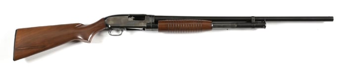 (C) WINCHESTER MODEL 12 SLIDE ACTION SHOTGUN.