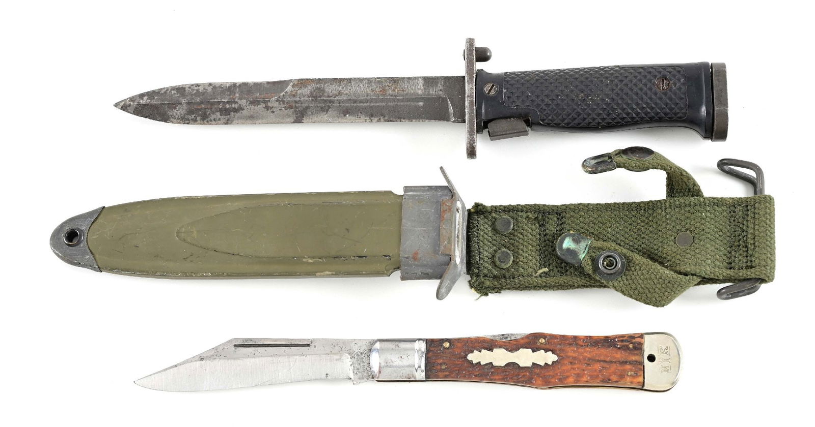 LOT OF 2: M5 BAYONET AND NEW YORK KNIFE CO. FOLDER.: Lot consists of: (A) US Cold War M5 bayonet marked "U.S./ M5 / AERIAL" on top of guard. Complete with scabbard marked "US M8A1 / P.W.H.". CONDITION: Good. (B) New York Knife Co. folding knife marked "