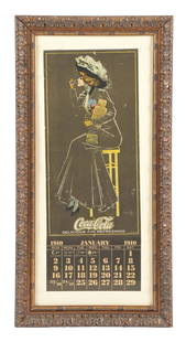 INCREDIBLE 1910 COCA-COLA CALENDAR W/ WOMAN ON STOOL: Single-Sided Paper. Maker marked "Wolf & Co. Phila." This incredibly rare calendar from Coca-Cola features artwork from artist Hamilton King and shows a beautifully dressed woman enjoying a Coca-Cola
