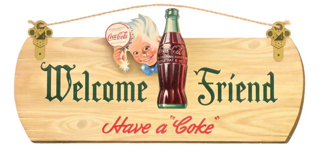 COCA-COLA SPRITE BOY WELCOME FRIEND DIE-CUT SIGN: A nice example of this C. 1944 die-cut cardboard sign from Coca-Cola featuring the iconic Sprite Boy graphic, with the "Welcome Friend" tagline. CONDITION: The sign shows a few rubs to the green
