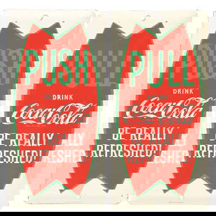 COLLECTION OF 2 COCA-COLA FISHTAIL PALM PRESS SIGNS: SST. Maker marked "Scioto Sign Co. Kenton, OH". A desirable set of single-sided tin palm press signs from Coca-Cola, featuring unusual vertical fishtail logos and "Push" "Pull" lettering. CONDITION: T