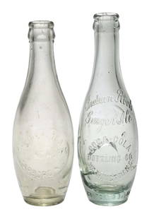 COLLECTION OF 2 COCA-COLA TEN PIN BOTTLES: (A) Clear Tarboro, North Carolina mid-body oval slug with "COCA-COLA BOTTLING WORKS / TARBORO, N.C.", "CONTENTS 7 OZ." on heel of backside. Chips around the lip, but overall a nice example. (8.0). (B)