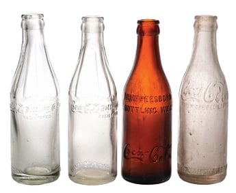 COLLECTION OF 4 COCA-COLA GLASS BOTTLES