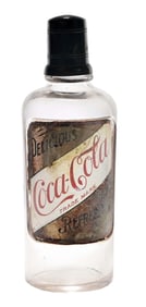 BACK BAR COCA-COLA SYRUP BOTTLE W/ LABEL UNDER GLASS