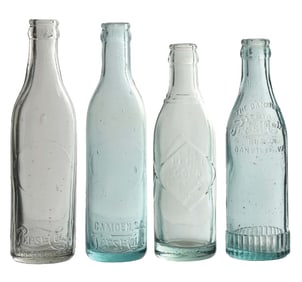COLLECTION OF 4 PEPSI-COLA EMBOSSED GLASS BOTTLES