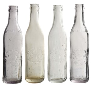 COLLECTION OF 4 PEPSI-COLA EMBOSSED GLASS BOTTLES