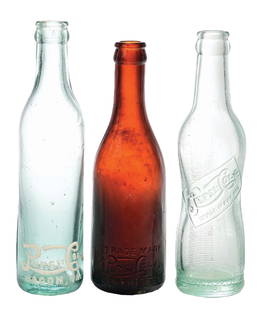 COLLECTION OF 3 PEPSI-COLA GLASS BOTTLES: (A) Macon, Georgia, base script. CONDITION: (9.0). (B) Amsterdam, New York, pinch bottle. CONDITION: Light case wear. (8.0). (C) Memphis, Tenneesee base slug plate. Amber. CONDITION: Bruise on the hee