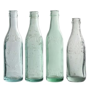 COLLECTION OF 4 PEPSI-COLA EMBOSSED GLASS BOTTLES