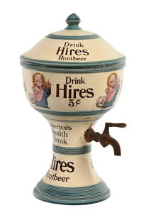 BLUE DRINK HIRES CERAMIC DISPENSER W/ UGLY KID GRAPHIC: Maker marked "Villeroy & Boch". This c. 1910-1920s ceramic syrup dispenser from Hires Root Beer features the Ugly Kid graphic, along with the company logo. This is the blue version of this style