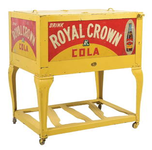 ROYAL CROWN COLA DOUBLE-DOOR COOLER: This c. 1940s double-door cooler from Royal Crown features nice embossed signage on all four sides with the company name and bottle graphic. CONDITION: The body of the cooler has been repainted