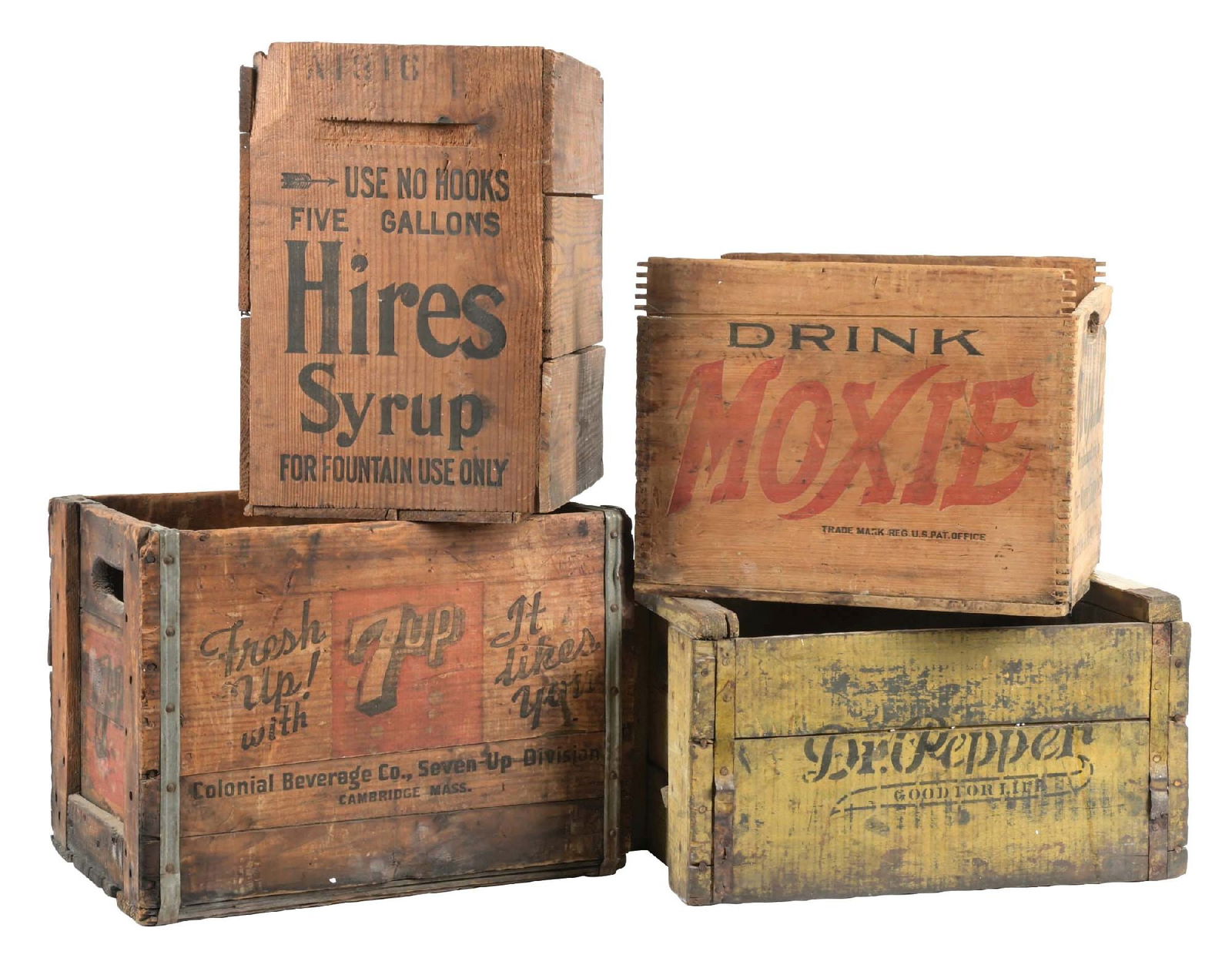 COLLECTION OF 4 VARIOUS SODA BRANDS WOODEN CRATES: A nice collection of four bottle crates from Dr. Pepper, Moxie, Hires, and 7UP. CONDITION: All remain sturdy and solid. The crates show areas of paint loss and wear to the logos, but still display nic
