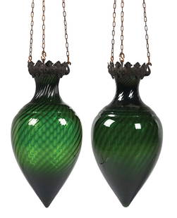 PAIR OF GREEN GLASS SODA FOUNTAIN PHARMACY SHOW GLOBES: C. 1910. Rare pair of striking green glass apothecary show globes. CONDITION: Original cast brackets with all original green glass. There are no chips, cracks or repairs. Comes with hanging chain and