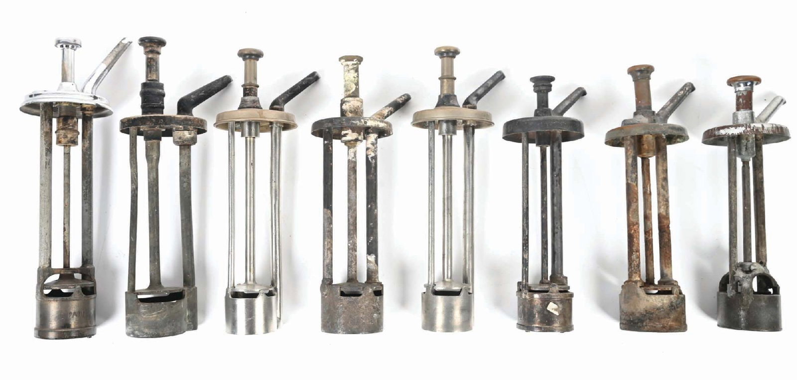 COLLECTION OF 8 SYRUP DISPENSER PUMPS: CONDITION: The pumps are in various conditions and different flavorings. Some operational, some not. They show areas of surface rust, oxidation and loss of paint or plating. Condition: (Good). Dimensi