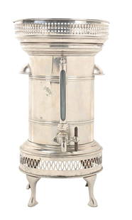 SODA FOUNTAIN DISPENSER MACHINE AND DISPLAY: This c. 1920s soda fountain dispenser has room to display syrup bottles on the top pedestal, while hot soda would have been dispensed from the metal cannister. CONDITION: The metal shows light wear an