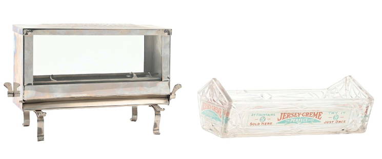 PAIR OF JERSEY CREAM STRAW DISPENSERS: C. 1920. CONDITION: (A) A Jersey Cream straw dispenser. Tin construction with mechanical operation in stainless steel. It shows very little signs of wear and no oxidation. (B) A Jersey Cream base to a