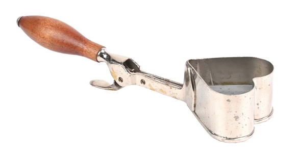 RARE HEART-SHAPED ICE CREAM SCOOP: C. 1925. CONDITION: Complete and operational, showing light wear to the wooden handle, no breaks or cracks. Smoke wear to the nickel plating, overall a great example. Condition: (Very Good).