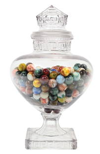 15-1/2" TROJAN CANDY JAR W/ GROUND STOPPER: C. 1910. CONDITION: It shows no cracks or breaks to the jar receptacle, inside and outside rim, or to the ground stopper. This is not a standard shippable item and will require 3rd party shipping or p