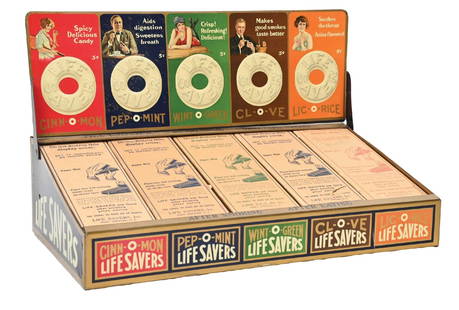LIFE SAVERS COUNTERTOP STORE DISPLAY: This C. 1930s tin countertop store display from Life Savers features four different product compartments, with the company logo and vibrant colors. CONDITION: The display remains clean overall with