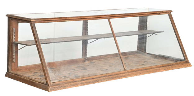 COUNTRY STORE COUNTERTOP PASTRY CASE IN OAK: C. 1910. CONDITION: It shows areas of scuffs, scrapes and scratches to the oak frame. It shows original interior hardware, wooden shelf, back doors and glass. This is not a standard shippable item and