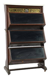 COUNTRY STORE CRAWFORDS BISCUITS 3-TIER TIN DISPLAY: C. 1915. CONDITION: All original wood construction with original reverse glass sign, advertising Crawfords Biscuits with a Coat of Arms. It has a new quartz top with original front doors to the bins,