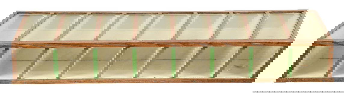 GENERAL STORE COUNTER TOP SALES DISPLAY CABINET: Marked "Sales Display Cabinet Co.". This C. 1940s small table top display cabinet features eight compartments with small access doors on the back. CONDITION: The glass is unbroken and the oak body has