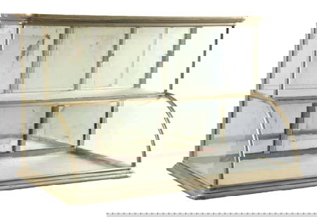 COUNTRY STORE CURVED GLASS SHOWCASE W/ RISER TOP: C. 1910. CONDITION: It shows all original German silver with wood-constructed showcase, with original mirrored backdoors and glass. The backdoor mirrors show oxidation and areas of mirror loss. There
