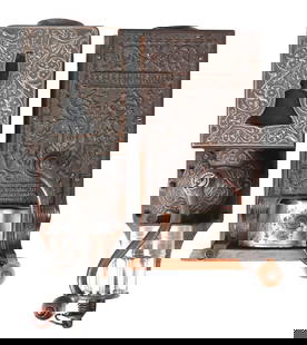 COLLECTION OF 2 CRANK-STYLE COFFEE GRINDERS: A nice collection of two phone-style coffee grinders, with nicely embossed cast iron features. CONDITION: Both remain in similar condition showing light wear to the metal and wood. Both handles crank.