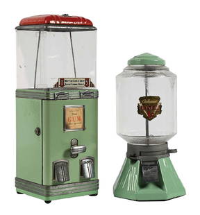 COLLECTION OF 2 1¢ AND 5¢ CANDY VENDING MACHINES: A nice collection of two c. 1940s-1950s candy machines, featuring nice porcelain finishes. CONDITION: Both machines retain their leys. The porcelain bodies of the machines show a few areas of color lo