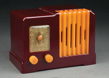 RARE GLOBE MODEL 532 CATALIN RADIO IN MERLOT AND YELLOW: C. 1939. This beautiful Art Deco radio features a butterscotch catalin 'waterfall' speaker insert grill and knobs. The GLOBE model radio differs from the Arvin in a few ways; dial and pointer are diff