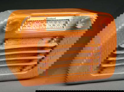 SENTINEL MODEL 284 "WAVY GRILL" CATALIN RADIO IN BUTTERSCOTCH: C. 1945 by The Sentinel Radio Company of Evanston, Illinois. Known to collectors as "Wavy Grill" Sentinel, the designers surely drew inspiration from the automotive world. CONDITION: The radio is a st