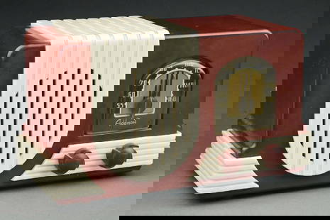 ADDISON MODEL 2 PLASKON RADIO IN MAROON AND IVORY: C. 1940 by Addison Industries Limited in Canada. Collectors consider this striking color combination to be a rare find. This stylized Art Deco radio features the famous 'waterfall' speaker grill trim