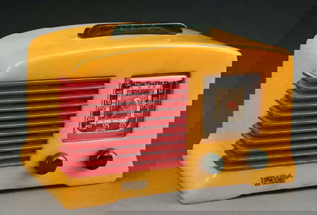 FADA L56 CATALIN RADIO IN YELLOW WITH RED AND GREEN ACCENTS: C. 1939. FADA Radio and Electric Co. CONDITION: No cracks or repairs noted, some surface scratches consistent with age and use. Red inset grill has nice marbling, and the set comes with green gumdrop