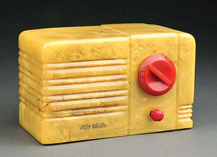 RCA VICTOR "LITTLE NIPPER" 9 TX CATALIN RADIO YELLOW WITH RED TRIM: C. 1939. Radio Corporation of America. Seldom Seen John Vassos Designed Deco Catalin Radio. CONDITION: Showing a repair to the lower-left corner, with no rear cover and with cord. Light wear and surfa