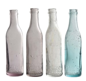 COLLECTION OF 4 PEPSI-COLA EMBOSSED GLASS BOTTLES