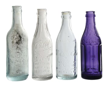 COLLECTION OF 4 VARIOUS GLASS SODA BOTTLES