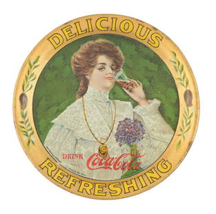 1906 COCA-COLA TIP TRAY W/ JUANITA GRAPHIC: Maker marked "Wolf & Co.". This c. 1906 tip tray from Coca-Cola features the company logo and woman known as Juanita. CONDITION: The field of the tray remains bright and glossy. There is one small