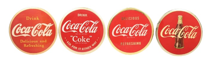 COLLECTION OF 4 CELLULOID COCA-COLA DISC SIGNS