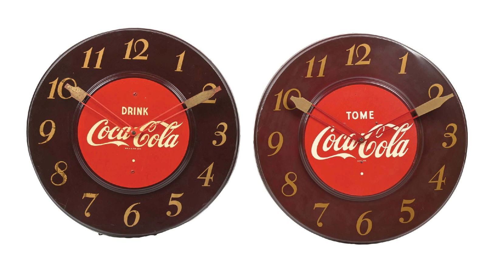 COLLECTION OF 2 MAROON COCA-COLA WALL CLOCKS: A nice collection of two single-sided tin wall clocks from Coca-Cola, including both the English and much more rare Spanish version. CONDITION: (A) The English version shows discoloration in the scrip