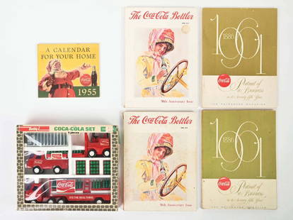 COCA-COLA BOOKS AND TOY TRUCK SET: This collection includes several paperback books from Coca-Cola and a NOS Buddy L toy set from the 1970s. CONDITION: The books all show light wear from storage, but are all legible and nice. The toy s