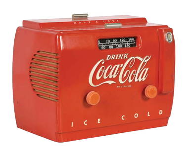 COCA-COLA COOLER RADIO: This c. 1950s cooler radio from Coca-Cola features the iconic script logo, and retains both its original knobs. CONDITION: The body of the radio shows a light crack on the left outer corner, with a fe