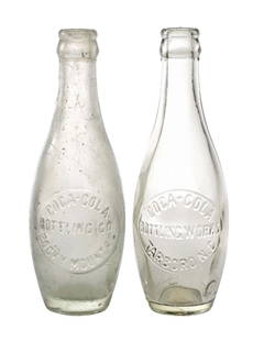 COLLECTION OF 2 COCA-COLA TEN PIN BOTTLES: (A) Clear Rocky Mount, North Carolina with mid-body round slug "COCA-COLA BOTTLING CO. / ROCKY MOUNT, N.C." and "CONTENTS 7 OZ." on heel. Cloudiness, internal crack and fleabites at heel and around li